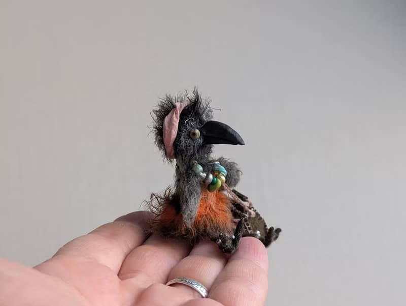Fashionista Crow. This beauty is crocheted.