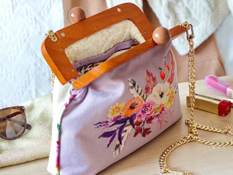 Handmade shoulder bag with cross stitched Boho bouquet, wooden clasp, crossbody
