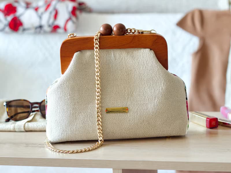 Handmade shoulder bag with cross stitched Boho bouquet, wooden clasp, crossbody