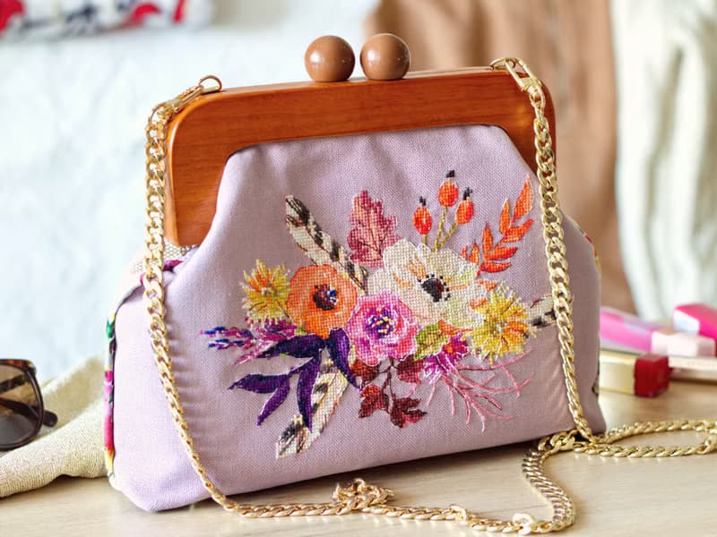 Handmade shoulder bag with cross stitched Boho bouquet, wooden clasp, crossbody