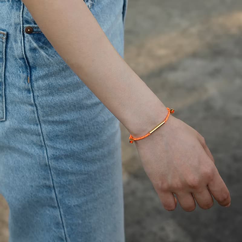LA LIGNE SINGLE STRING BRACELET ORANGE DOT