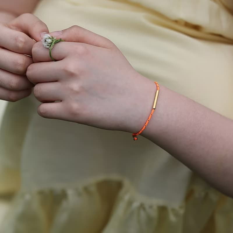 LA LIGNE SINGLE STRING BRACELET ORANGE DOT