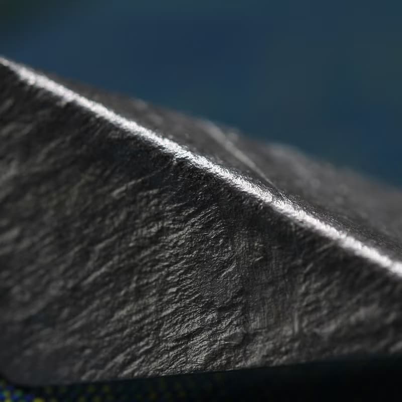 Handmade earrings with bended textured silver pieces on a long stem (E0184)