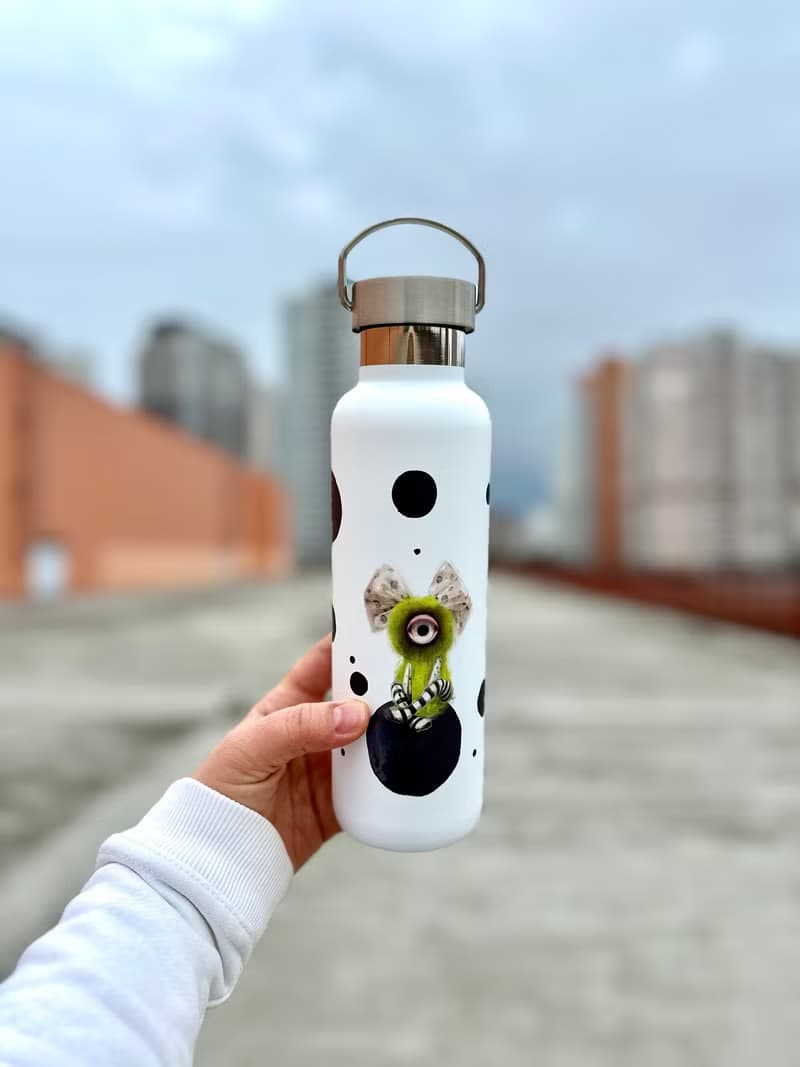 Steel bottle in cyclops style. Stainless steel thermos. Bottle for water