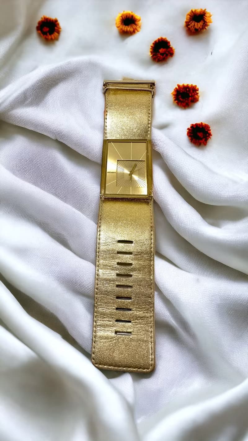 NIXON 金色寬帶腕錶