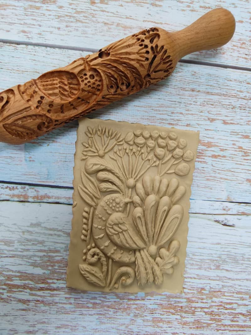 A small rolling pin for cookies,drawing a bird