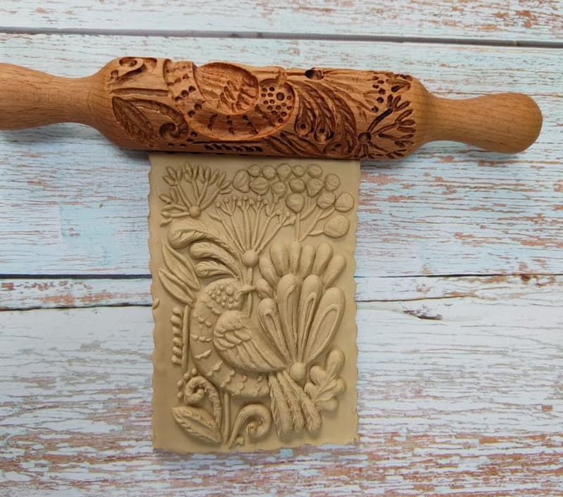 A small rolling pin for cookies,drawing a bird