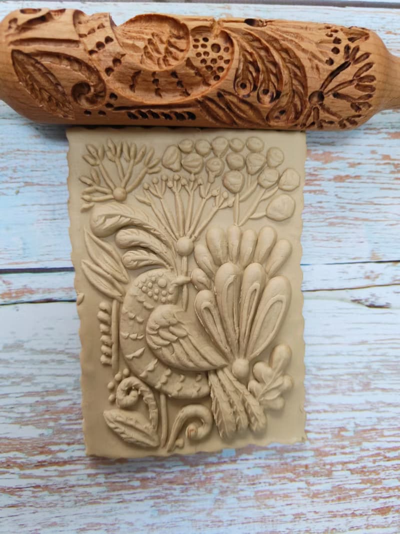 A small rolling pin for cookies,drawing a bird