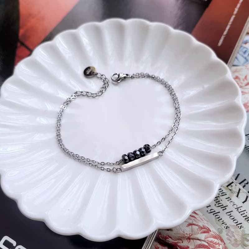 深夜邂逅。黑膽石簡約直條造型白鋼手鍊