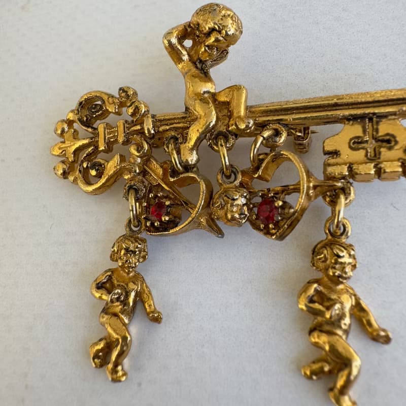 Vintage ART Signed Brooch Gold Tone Key with Angel Cherub Cupid Hearts Ruby pin