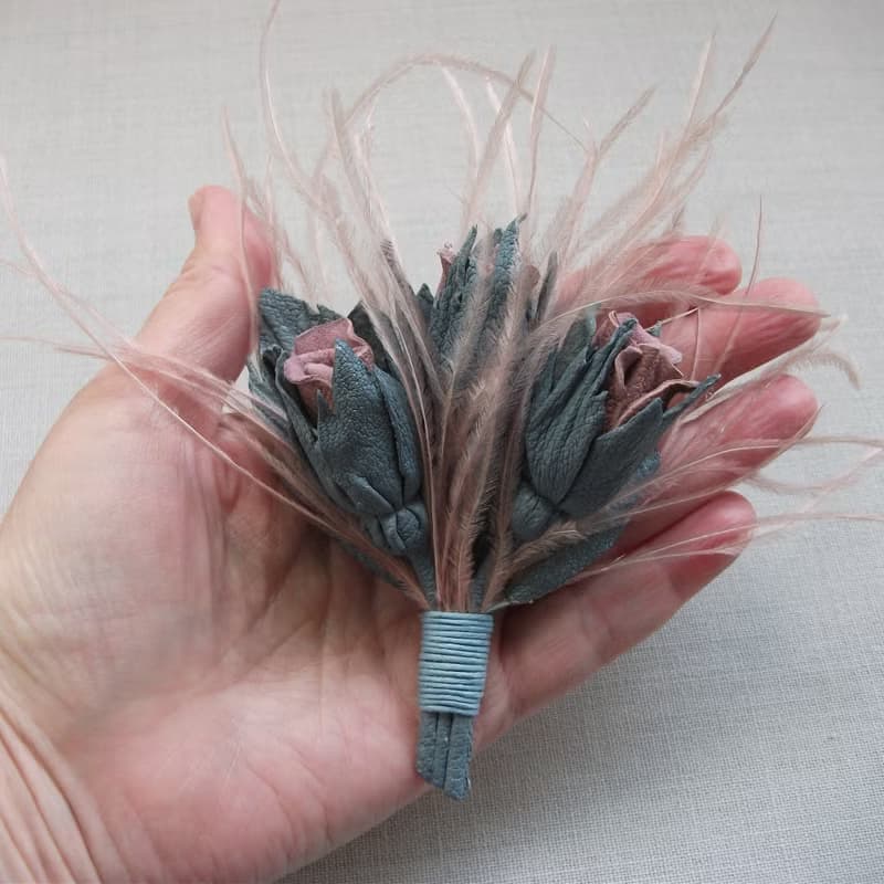 Leather brooch with a bouquet of roses and ostrich feathers