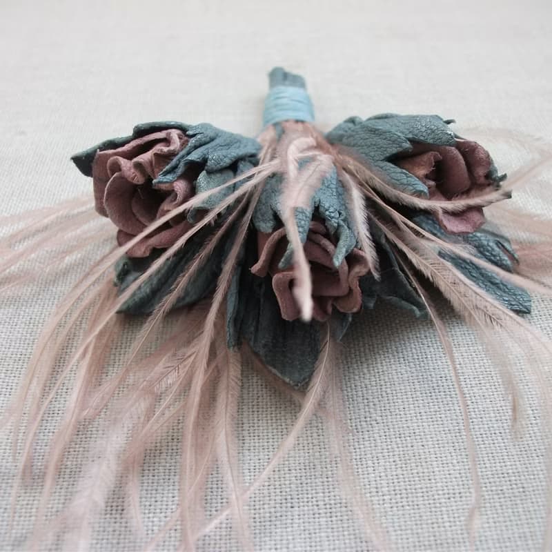 Leather brooch with a bouquet of roses and ostrich feathers