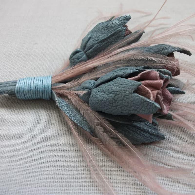 Leather brooch with a bouquet of roses and ostrich feathers