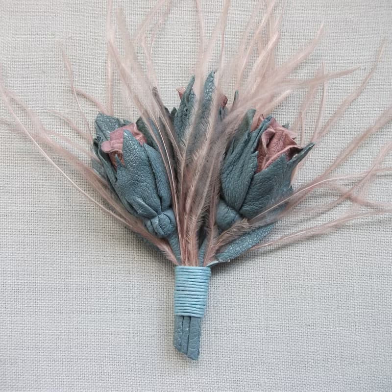 Leather brooch with a bouquet of roses and ostrich feathers