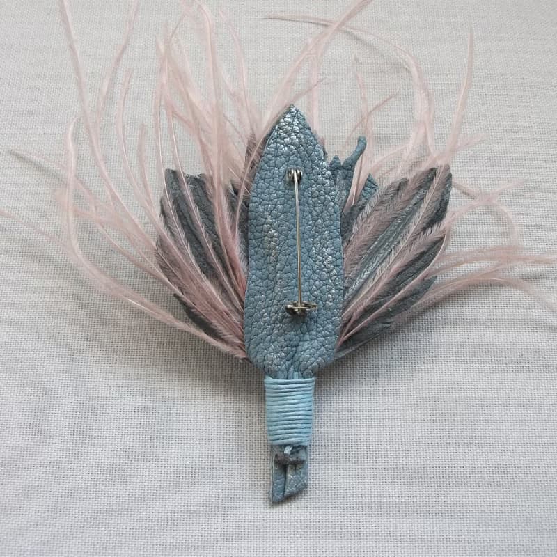 Leather brooch with a bouquet of roses and ostrich feathers