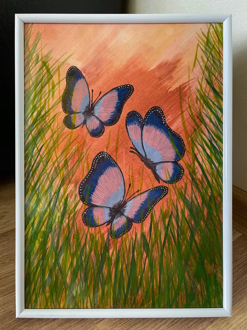 Cheerful dancing butterflies in green grass. Watercolor.