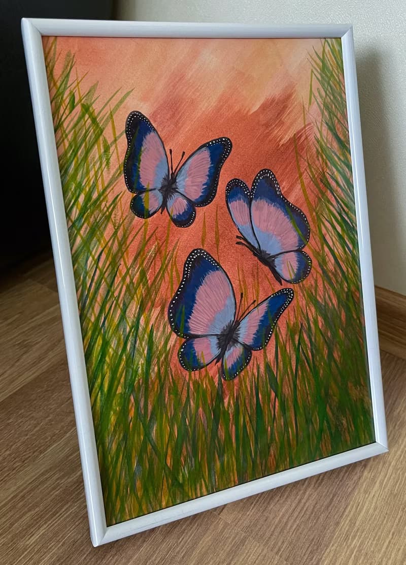 Cheerful dancing butterflies in green grass. Watercolor.