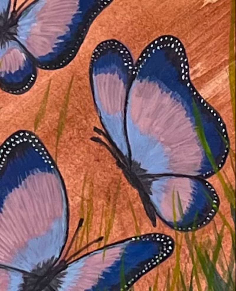 Cheerful dancing butterflies in green grass. Watercolor.