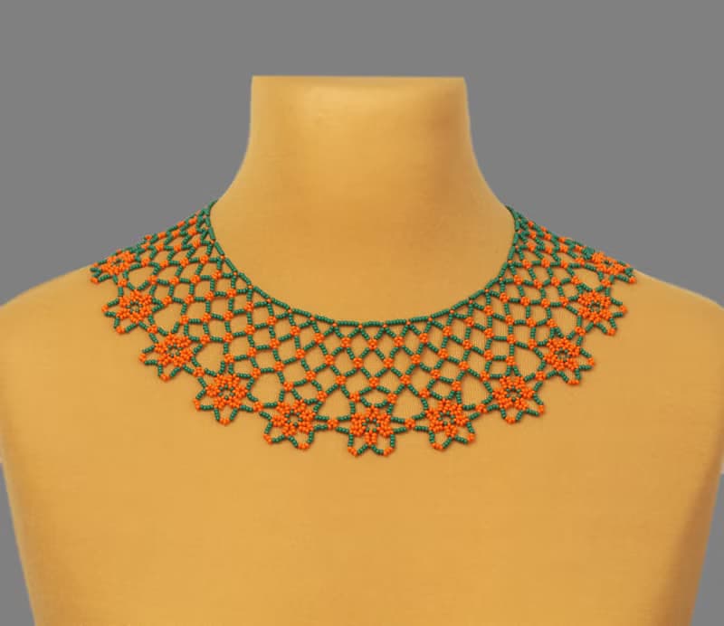 Green necklace with orange flower