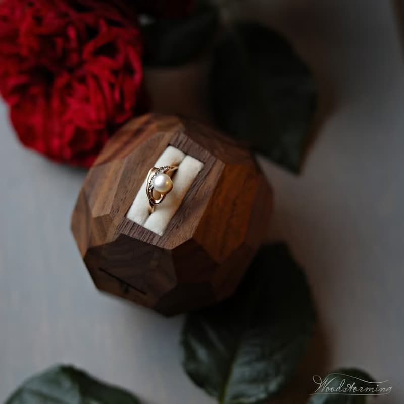 Wooden faceted sculptural ring display with white pillow by Woodstorming
