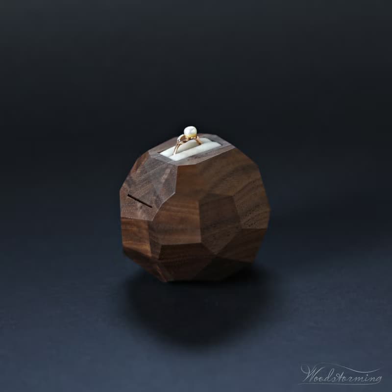 Wooden faceted sculptural ring display with white pillow by Woodstorming