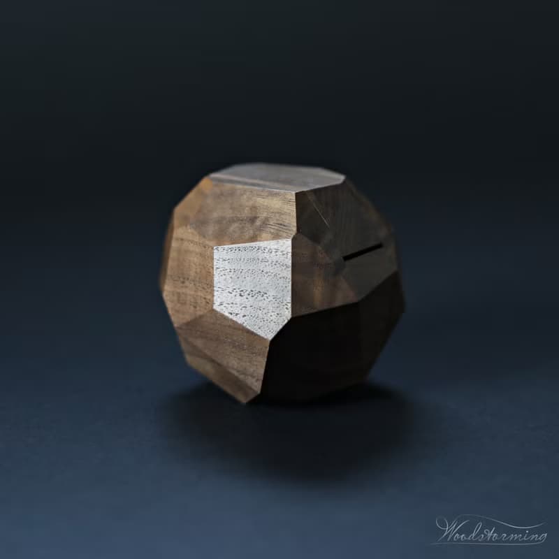 Wooden faceted sculptural ring display with white pillow by Woodstorming