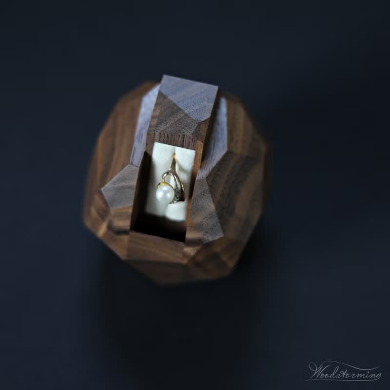 Wooden faceted sculptural ring display with white pillow by Woodstorming