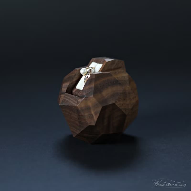 Wooden faceted sculptural ring display with white pillow by Woodstorming
