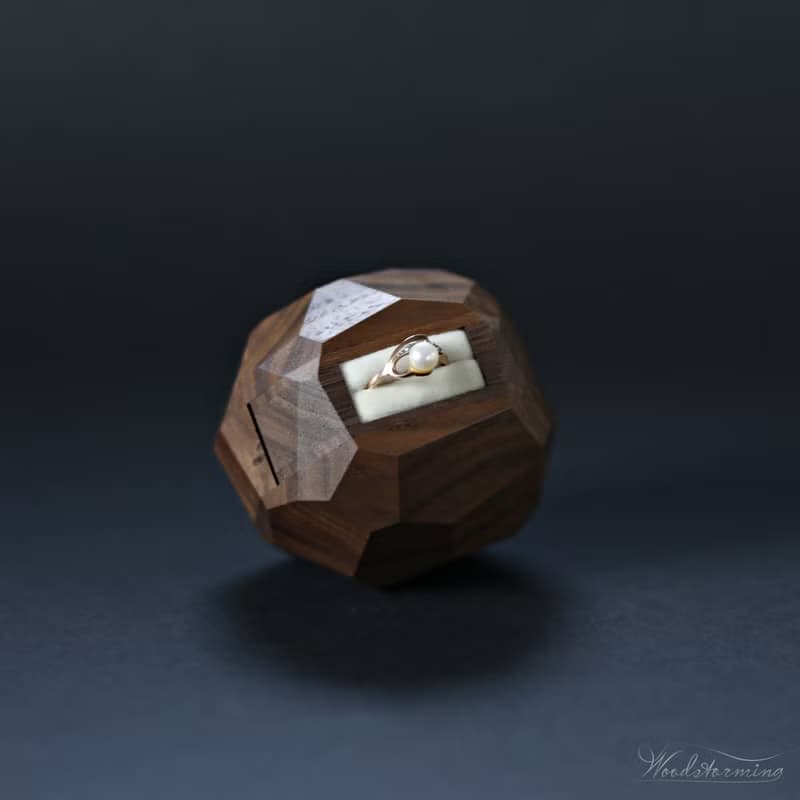Wooden faceted sculptural ring display with white pillow by Woodstorming