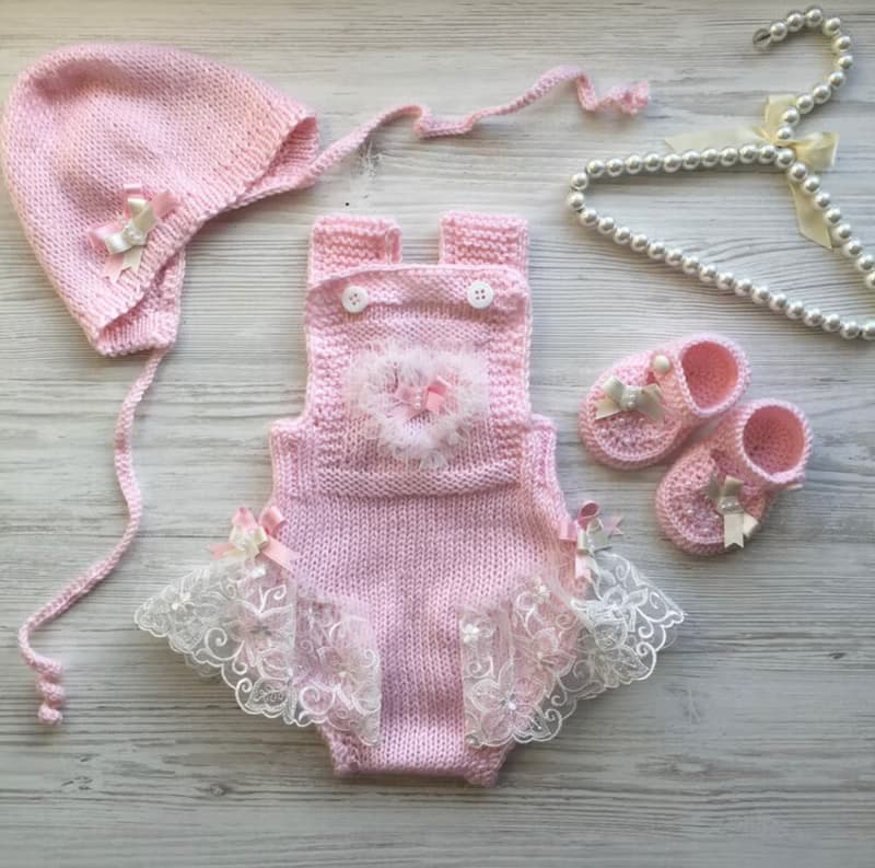 Hand knit pink romper with ivory lace, hat and shoes for baby girl.