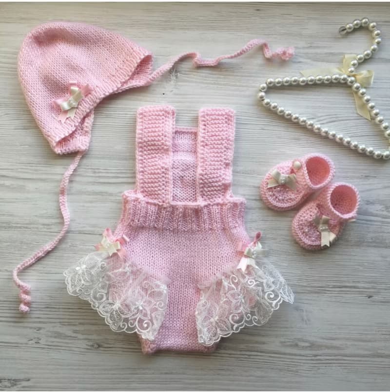 Hand knit pink romper with ivory lace, hat and shoes for baby girl.