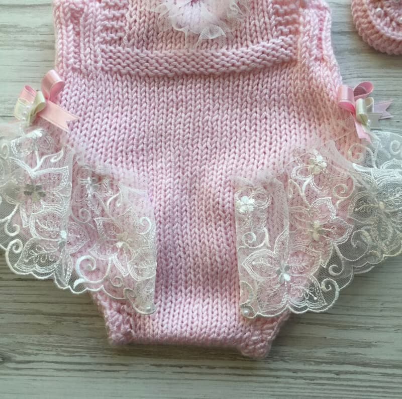 Hand knit pink romper with ivory lace, hat and shoes for baby girl.