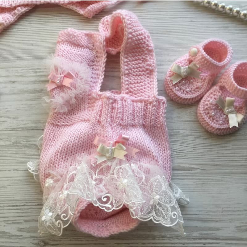 Hand knit pink romper with ivory lace, hat and shoes for baby girl.