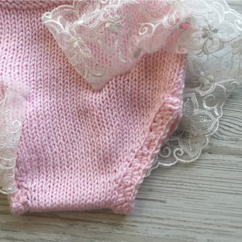 Hand knit pink romper with ivory lace, hat and shoes for baby girl.