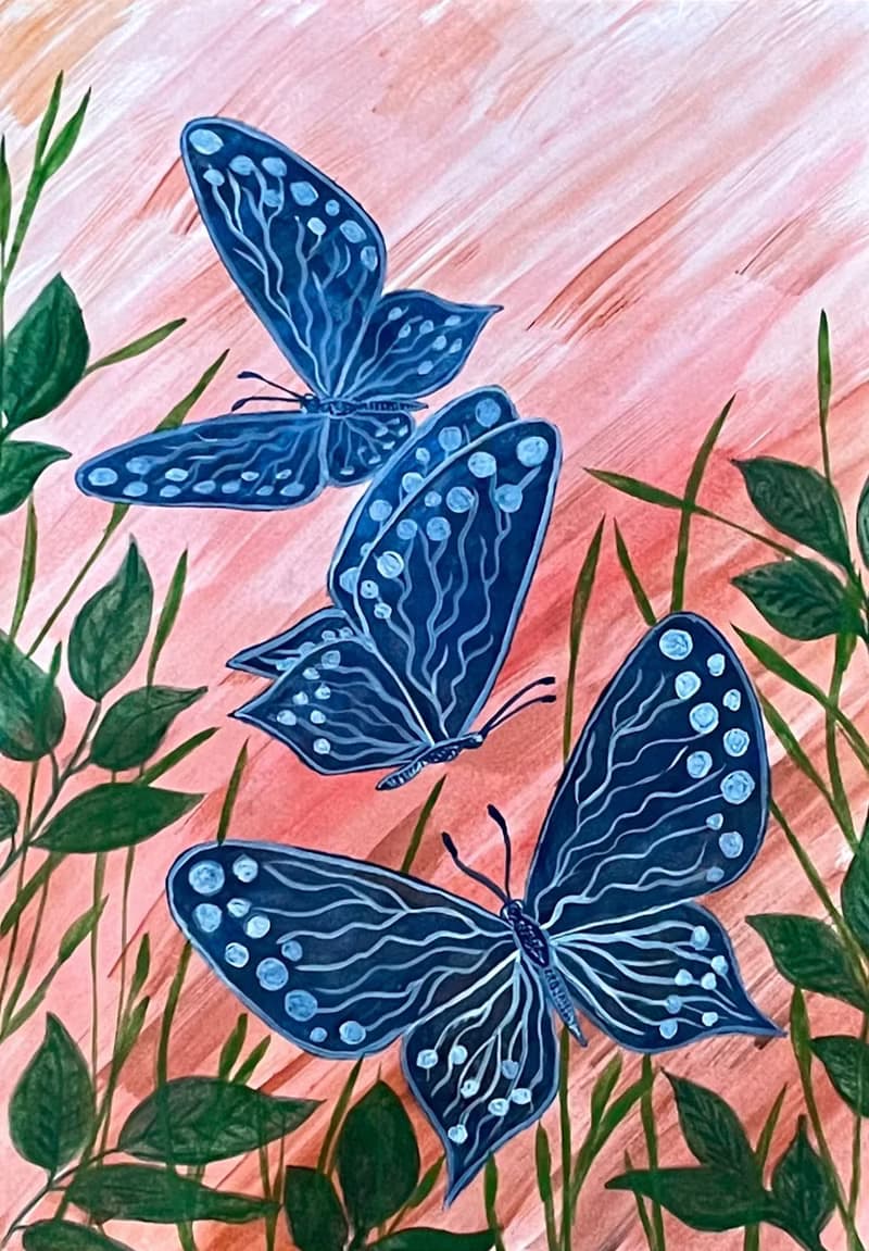 White-blue butterflies against the backdrop of fiery sunset.