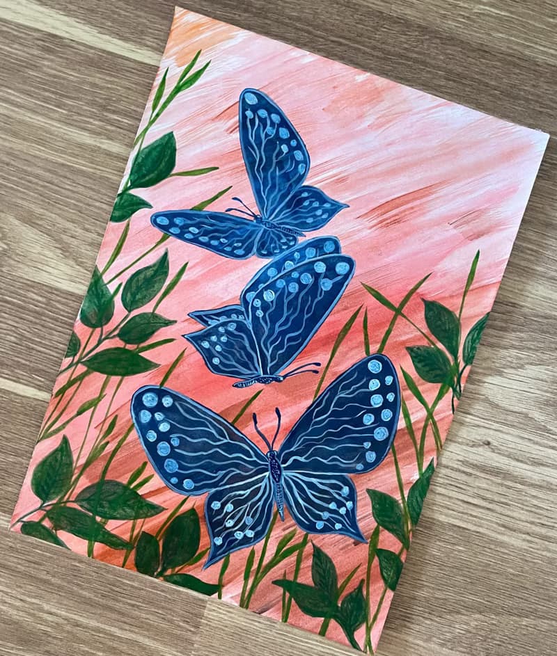 White-blue butterflies against the backdrop of fiery sunset.