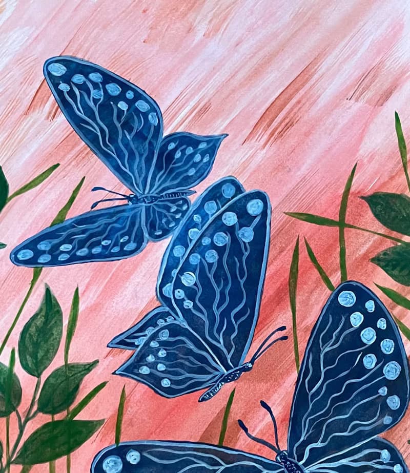 White-blue butterflies against the backdrop of fiery sunset.