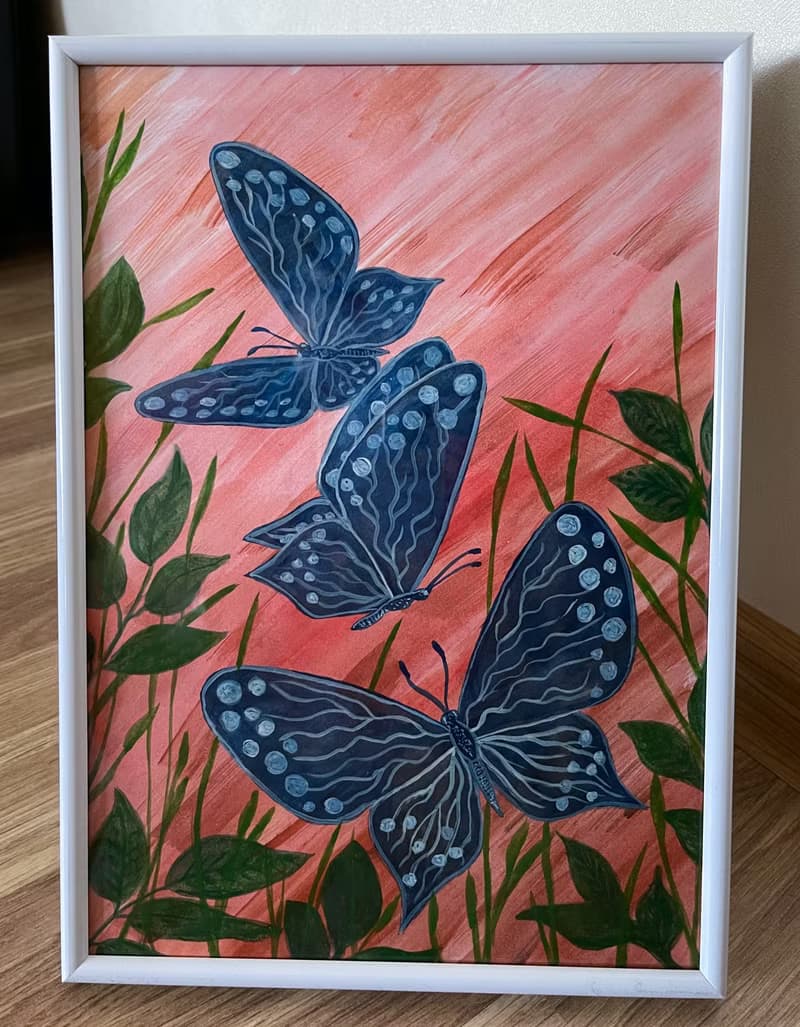 White-blue butterflies against the backdrop of fiery sunset.