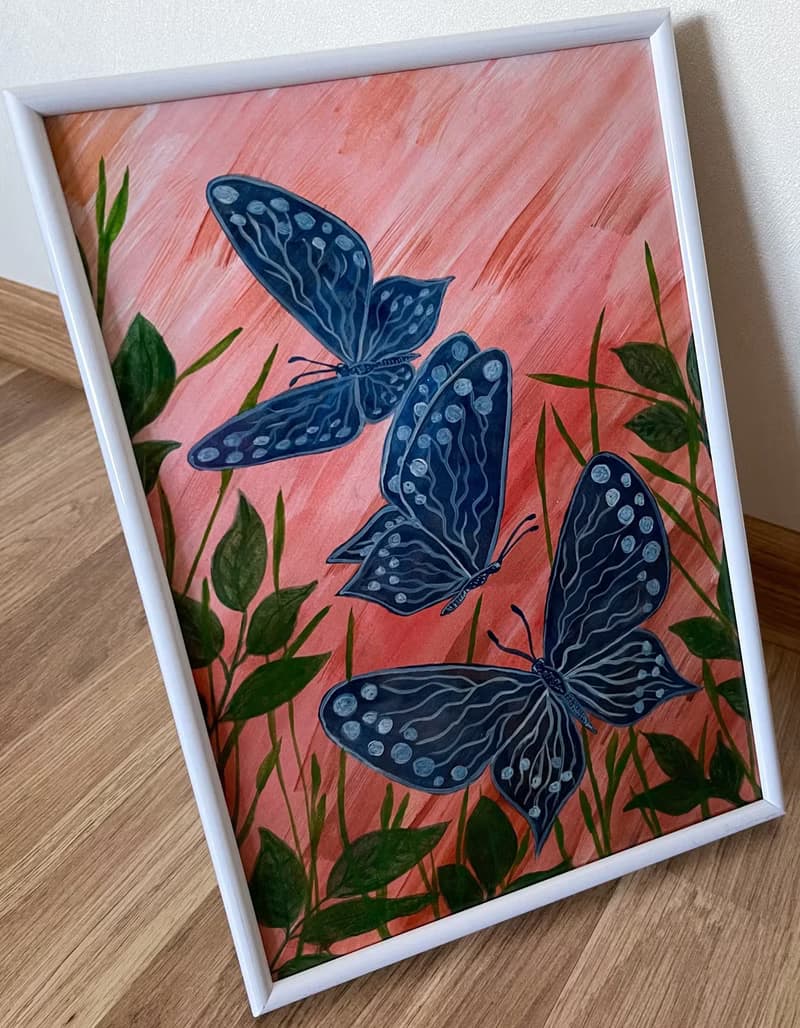 White-blue butterflies against the backdrop of fiery sunset.