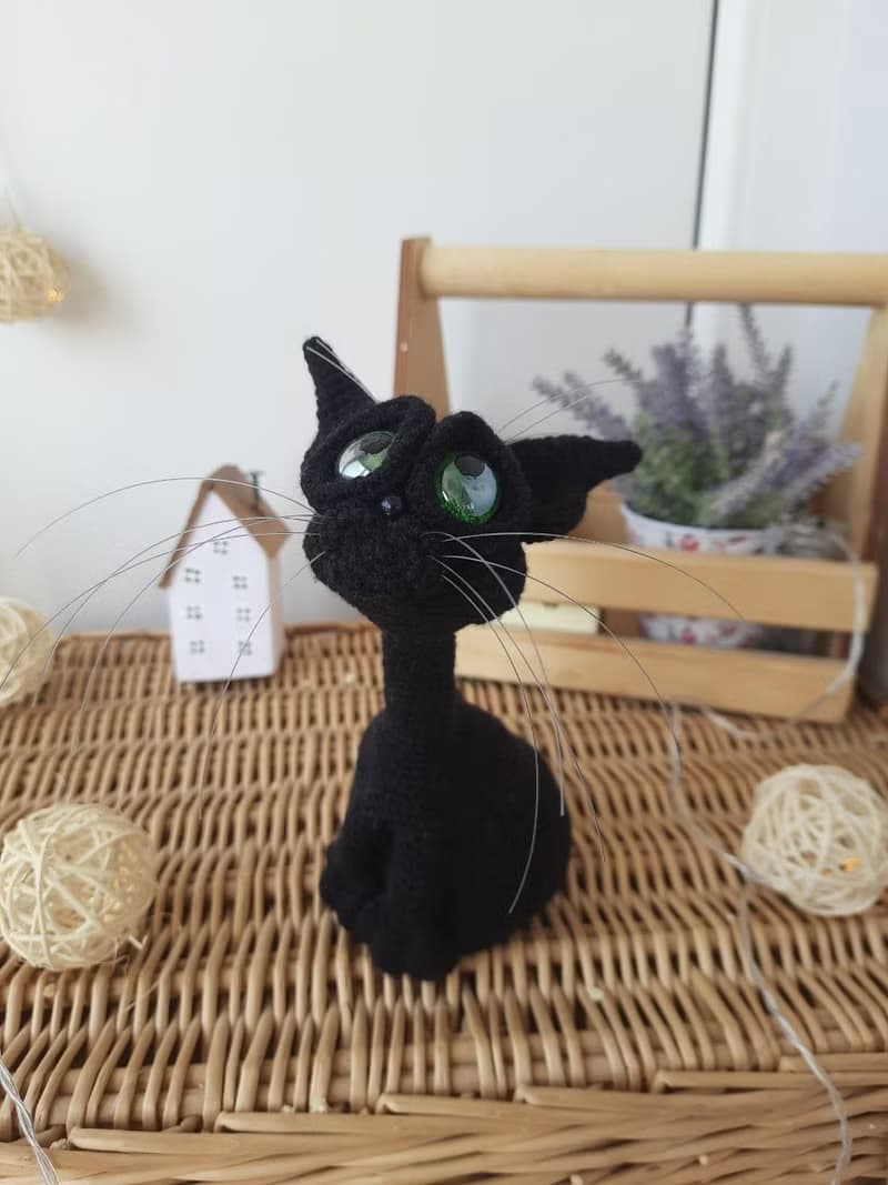 Interior cat toy sculpture . Knitting sitting realistic pet replica. Cat toy