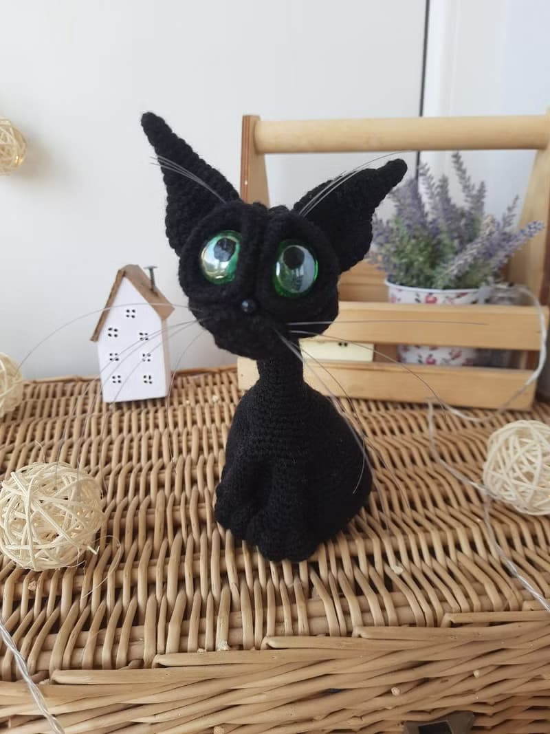 Interior cat toy sculpture . Knitting sitting realistic pet replica. Cat toy