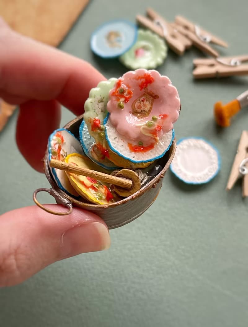 A miniature basin with dirty dishes