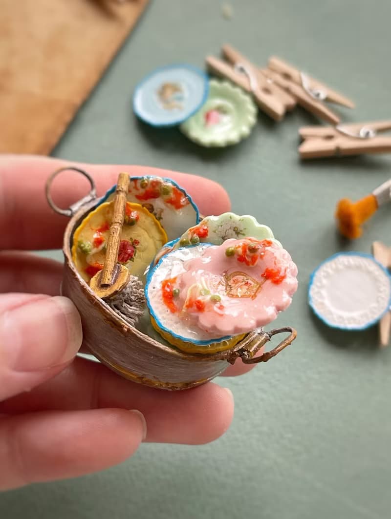 A miniature basin with dirty dishes