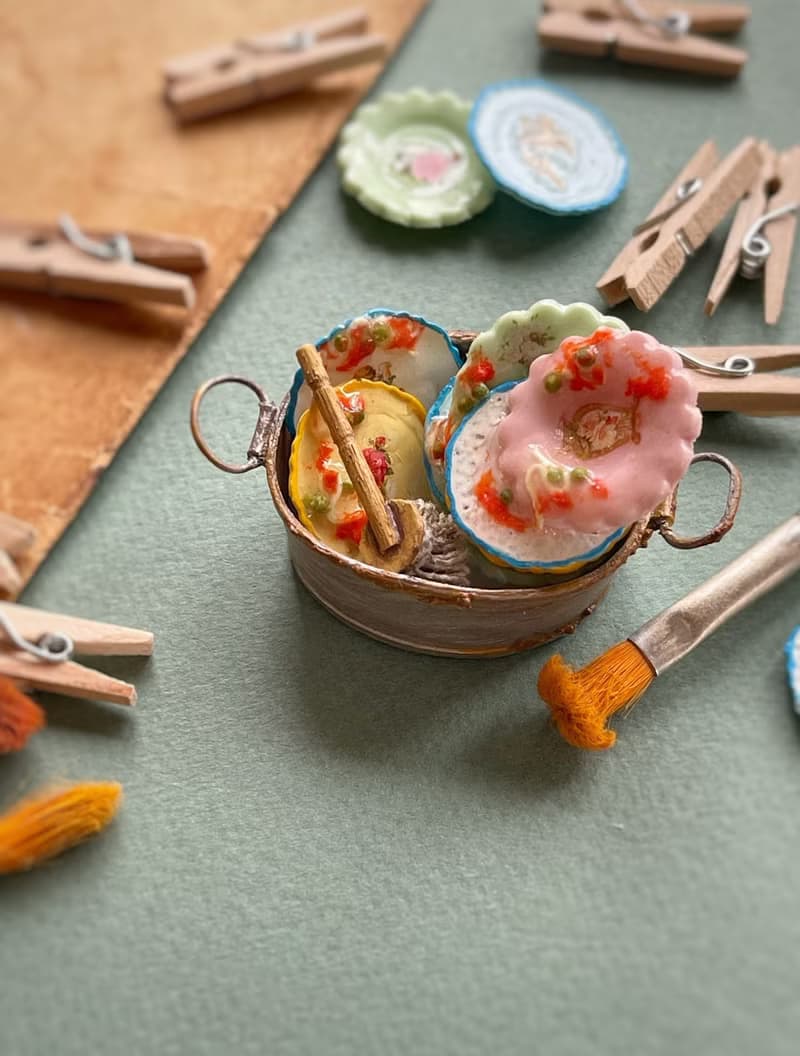 A miniature basin with dirty dishes