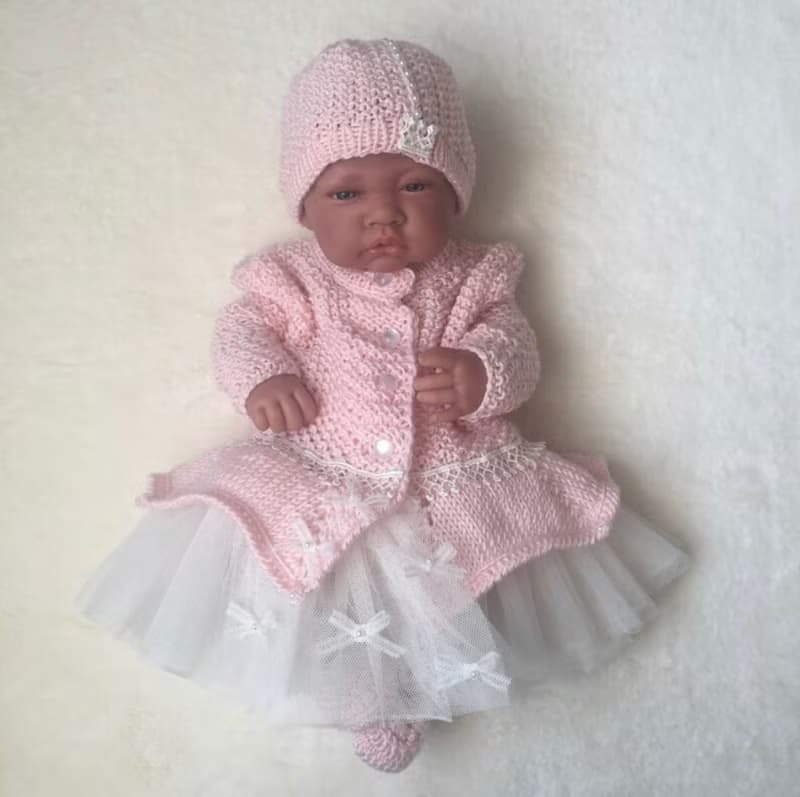 Hand knit pink outfit for baby girl. Dress with pearls and lace, hat, booties.