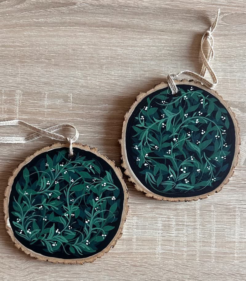 Delicate Floral Ornament on Wooden Slice