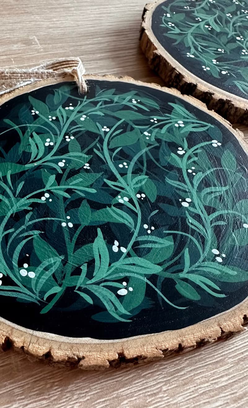 Delicate Floral Ornament on Wooden Slice