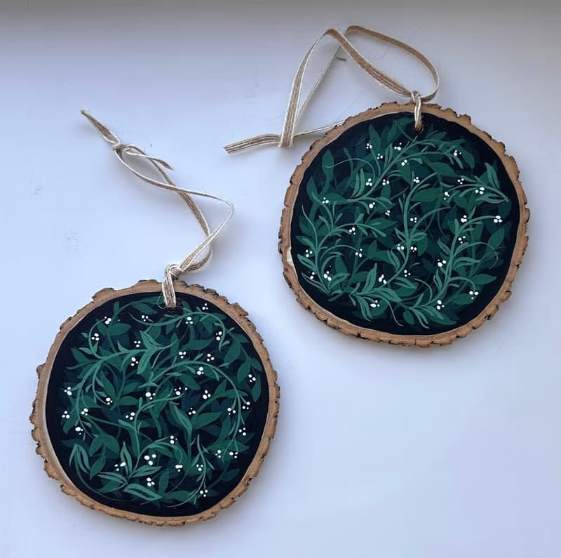 Delicate Floral Ornament on Wooden Slice