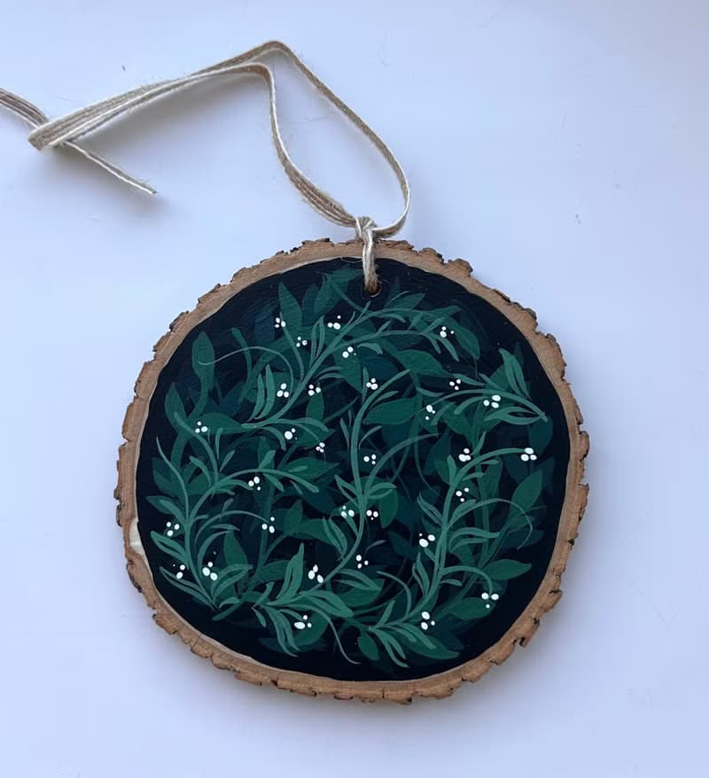 Delicate Floral Ornament on Wooden Slice