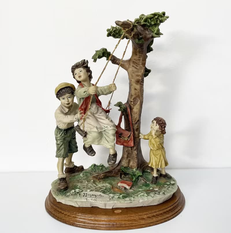 Capodimonte – Large sculpture of children on a swing